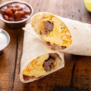 Breakfast burrito with sausage, eggs, hashbrown and cheese