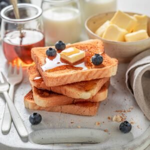 Delicious french toast with fresh berries and honey