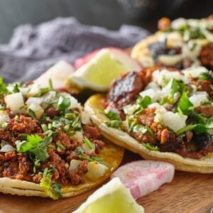 mexican street tacos with carne asada on corn tortillas platter