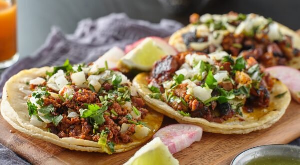 mexican street tacos with carne asada on corn tortillas platter